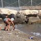 Bambino-Spiaggia-Pulizia